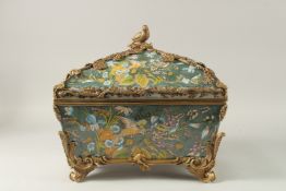 A LARGE PORCELAIN CASKET AND COVER with green ground, decorated with flowers, with gilt mount and