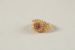 AN 18CT YELLOW GOLD AND RUBY CLUSTER RING. Ring size (K 0.5).