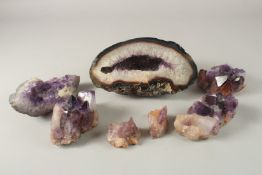 A GOOD COLLECTION OF AMETHYST ROCK CRYSTALS, various sizes. 7cms to 23cms.