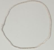 AN EXCEPTIONAL 18CT WHITE GOLD RBC DIAMOND LINE NECKLACE with open box clasp and safety catch with