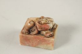 A CARVED SOAPSTONE SEAL with a KYLIN. 5cms x 4cms.