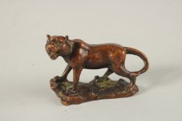 A JAPANESE BRONZE TIGER. 7cms long.