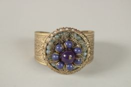 A LARGE GILT METAL AND HARDSTONE BANGLE. 1521.