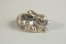 A RUSSIAN SILVER RABBIT with blue eyes. 6cms long. Faberge mark, 60grams.