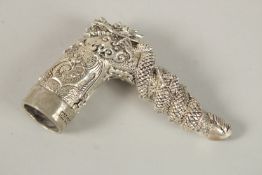 A SILVER PLATED DRAGON CANE HANDLE.