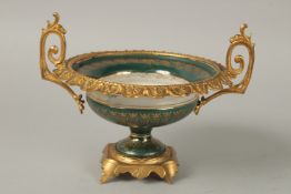 A CONTINENTAL PORCELAIN AND GILT METAL TWO HANDLED BOWL painted with flowers. 17sm diameter.
