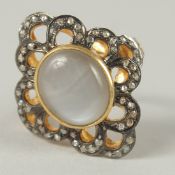 A CABOCHON MOONSTONE AND DIAMOND COCKTAIL RING in silver gilt. Rose cut diamonds 0.44ct.