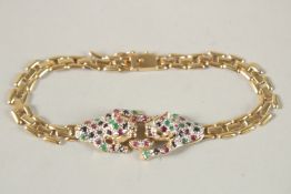 A 14CT GOLD DIAMOND AND RUBY SET PANTHER BRACELET.