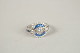 A SILVER FAUX SAPPHIRE AND CZ RING. Ring size (P).