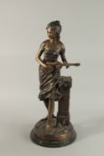 A GOOD BRONZE OF A YOUNG GIRL playing guitar, on a circular base. 66cm high.