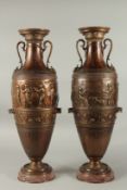 A SUPERB LARGE PAIR OF CLASSICAL BRONZE VASES with Egyptian sconces, on circular marble bases. 60cms