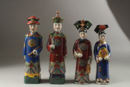 FOUR VARIOUS CHINESE PORCELAIN FIGURES. 30cms high.