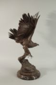 JULES MOIGNIEZ(1835 - 1894) FRENCH A SUPERB BRONZE OF A EAGLE ON A BRANCH. Signed 77cm high, on a
