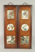 A PAIR OF THREE CHINESE REVERSE GLASS PAINTINGS INSET WITHIN WOODEN HANGING PANELS, each panel