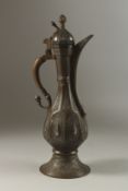 A FINE 19TH CENTURY CENTRAL ASIAN BUKHARA ENGRAVED BRASS EWER, with silvered drop decoration and