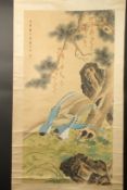 A CHINESE SCROLL PAINTING ON SILK, depicting birds in a woodland setting, inscribed upper left