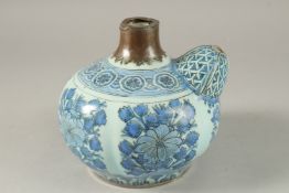 A FINE 17TH CENTURY SAFAVID PERSIAN BLUE AND WHITE KENDI, with floral panel decoration.