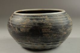 A RARE POSSIBLY 14TH-15TH CENTURY SYRIAN MAMLUK MARVERED GLASS BOWL, 14.5cm diameter.