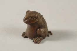 A BRONZE OKIMONO OF A FROG.