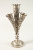 A CHINESE SILVER OPENWORK CENTREPIECE, with four trumpet shaped apertures and dragon designs, 31cm