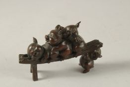 A BRONZE OKIMONO GROUP OF PIGS, 12cm long.