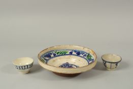 A 19TH CENTURY POSSIBLY OTTOMAN TURKISH CHANAKKALE DISH, and two similar smaller bowls, dish 21cm