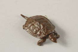 A BRONZE OKIMONO OF A TURTLE.