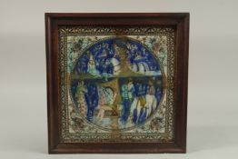 A 19TH CENTURY PERSIAN QAJAR GLAZED POTTERY TILE, the centre with circular roundel depicting various