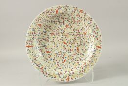 A LARGE CHINESE POLYCHROME PORCELAIN PLATE, painted with ruyi and bats, the base with six-