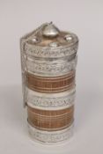 AN OMANI SILVER MOUNTED WOODEN CYLINDRICAL POWDER BOX, 16cm high.