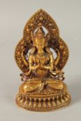 A TIBETAN GILT ALLOY BUDDHA, 17cm high.