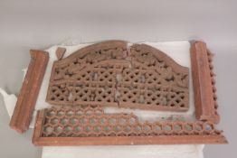 A LARGE MUGHAL INDIAN RED STONE JALI PANEL, with other fragments of similar pieces.