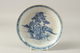 A CHINESE BLUE AND WHITE PORCELAIN PLATE, painted with female figures, the base with character mark,