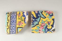 TWO 19TH CENTURY PERSIAN QAJAR YELLOW GLAZED TILES, largest 18.5cm x 18.5cm.