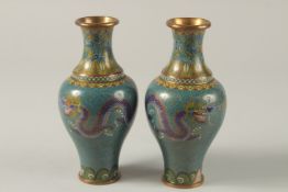 A PAIR OF CHINESE TURQUOISE GROUND CLOISONNE DRAGON VASES, 16.5cm high,