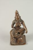 A SMALL 15TH-16TH CENTURY SOUTH INDIAN VIJAYANAGAR BRONZE FIGURE OF A FEMALE DEITY, seated in