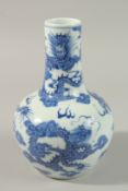 A CHINESE BLUE AND WHITE PORCELAIN DRAGON VASE, painted with four dragons amongst stylised clouds,