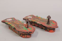A FINE PAIR OF 19TH CENTURY MALAYSIAN POLYCHROMED CARVED WOODEN SANDLES, 24cm long.