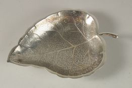 A FINE 19TH CENTURY THAI LEAF-SHAPED SILVER BOWL, with finely engraved decoration, 23.5cm long.