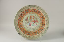 A FINE CHINESE CANTON FAMILLE ROSE PORCELAIN CHARGER, painted with central panel depicting figures