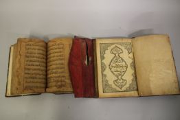 A EARLY ISLAMIC POSSIBLY PERSIAN HANDWRITTEN QURAN, and another printed Quran, dated 1300 ad, (2).