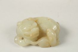 A FINE 19TH-20TH CENTURY CHINESE CARVED JADE FOO DOG, 7.5cm.