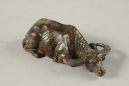 A BRONZE OKIMONO OF A BUFFALO.