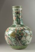 A VERY LARGE CHINESE FAMILLE VERTE PORCELAIN BULBOUS VASE, painted with various exotic birds and