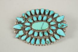 A VERY FINE NAVAJO TURQUOISE BEAD INSET SILVER BROOCH, 6cm x 4.5cm.