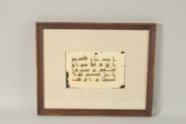 A DOUBLE-SIDED KUFIC CALLIGRAPHY MANUSCRIPT PAGE, framed and glazed.