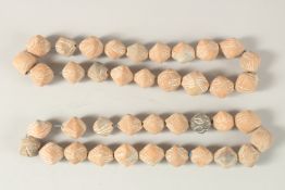 TWO CARVED TERRACOTTA BEADED NECKLACES.