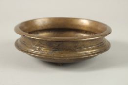 AN 18TH CENTURY PERSIAN BRASS BOWL, 15cm diameter.
