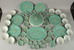 A CHINESE TURQUOISE FAMILLE ROSE MUN SHOU PORCELAIN DINNER SERVICE, with character marks to base,