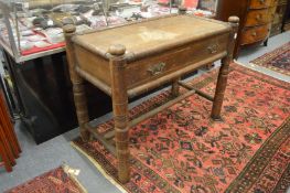 An unusual oak single drawer side table with turned framework and legs.